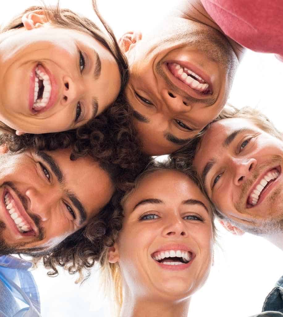 Smiling person showcasing white teeth after laser whitening treatment Luton